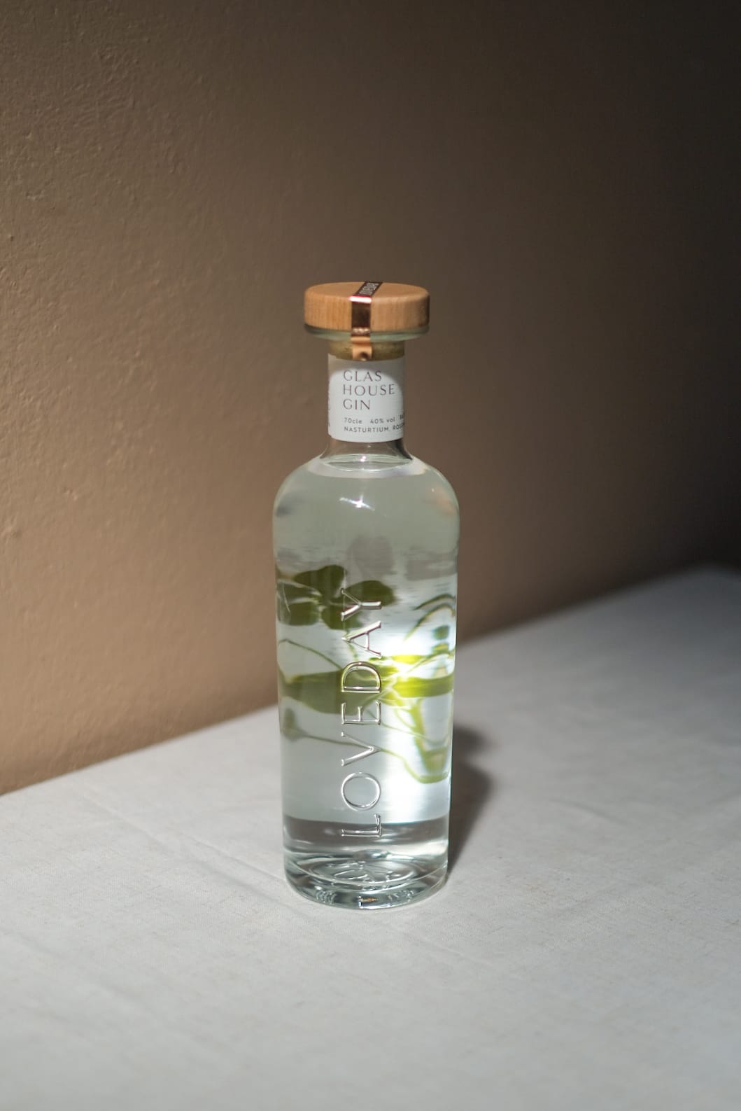Glas House Gin bottle by Loveday Distillery, clear glass with botanical infusion, wooden cap, white neck label, 70cl 40% vol